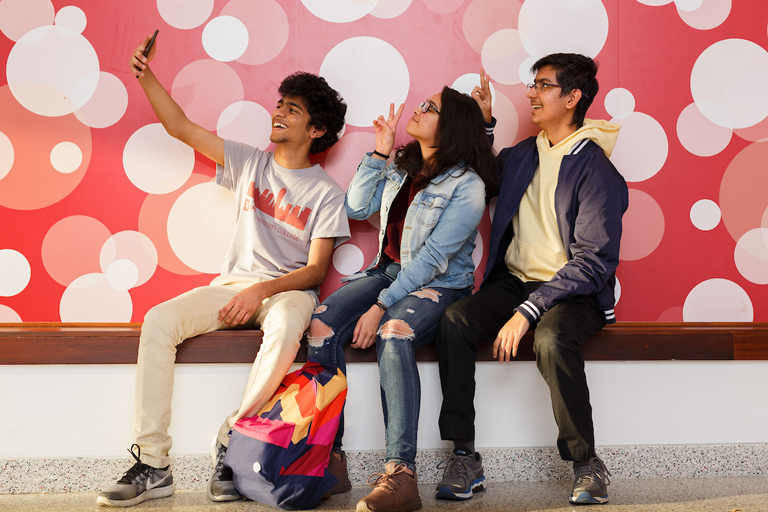 A group of students take a selfie in North Hall.