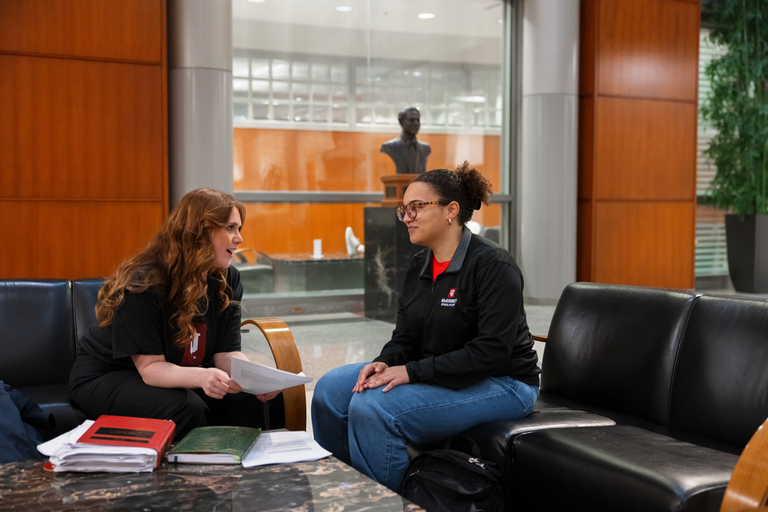 Students sitting in chairs and talking