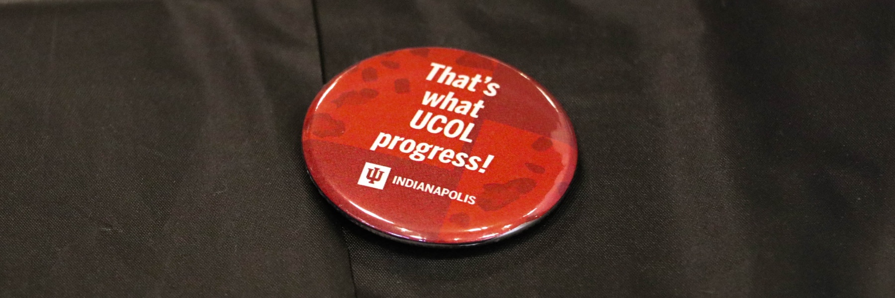 A badge saying 'That's what UCOL progress'