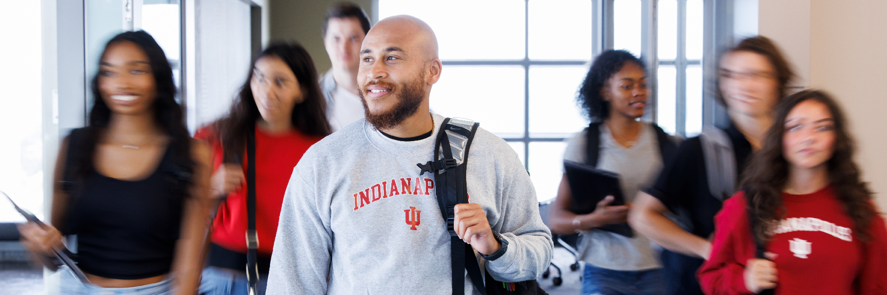 A student walking down a hallway