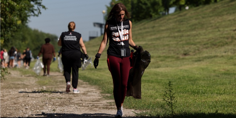 A woman in white river bridge cleanup