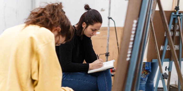 Students drawing in a Herron classroom