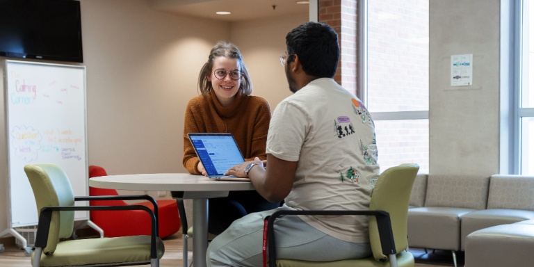 An HLS student with an advisor