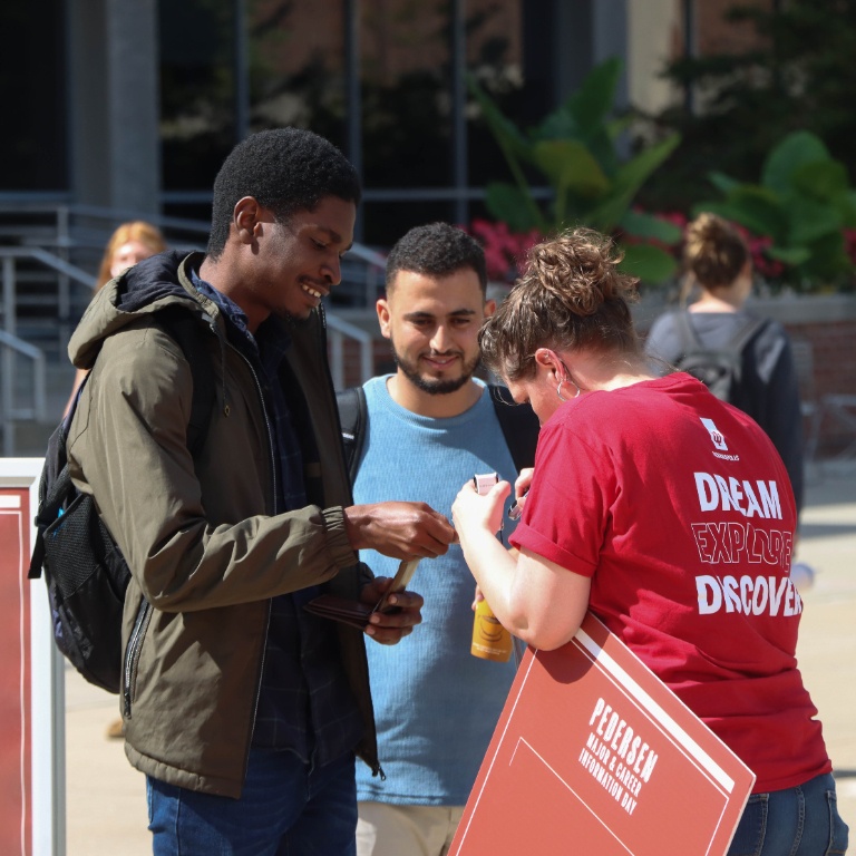 Students having a discussion at the Pedersen Information Day